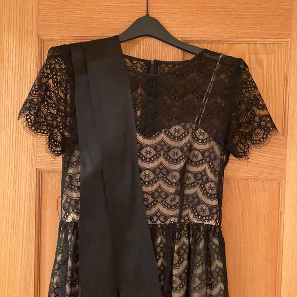 Black lace cocktail dress with nude underlay - Picture 2 of 4
